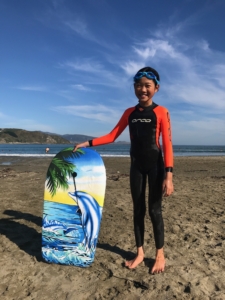 Girl with boogie board New Zealand