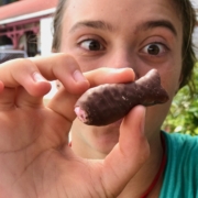 Girl with chocolate fish in New Zealand