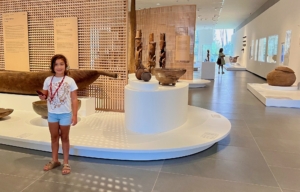 girl exploring audio tour in Tahiti museum
