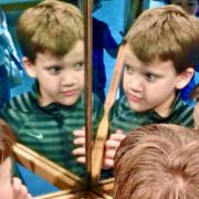 boy looking in mirror, AI, worldschooling