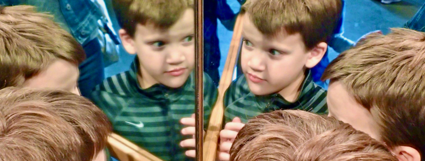 boy looking in mirror, AI, worldschooling