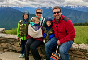 family with junior ranger badges, worldschooling