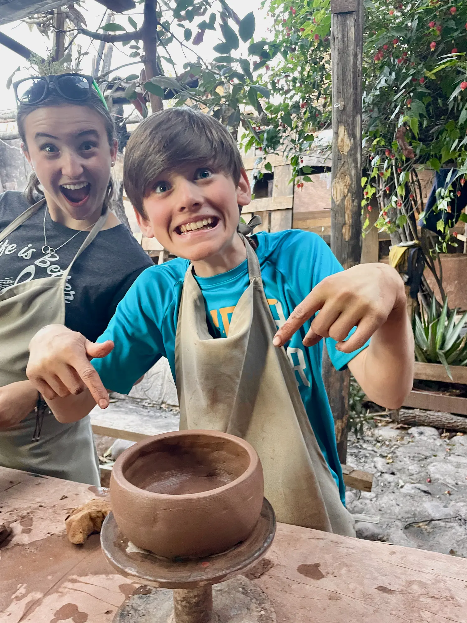 jace making a bowl in pottery class while worldschooling