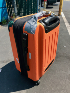 old suitcase, worldschooling logistics