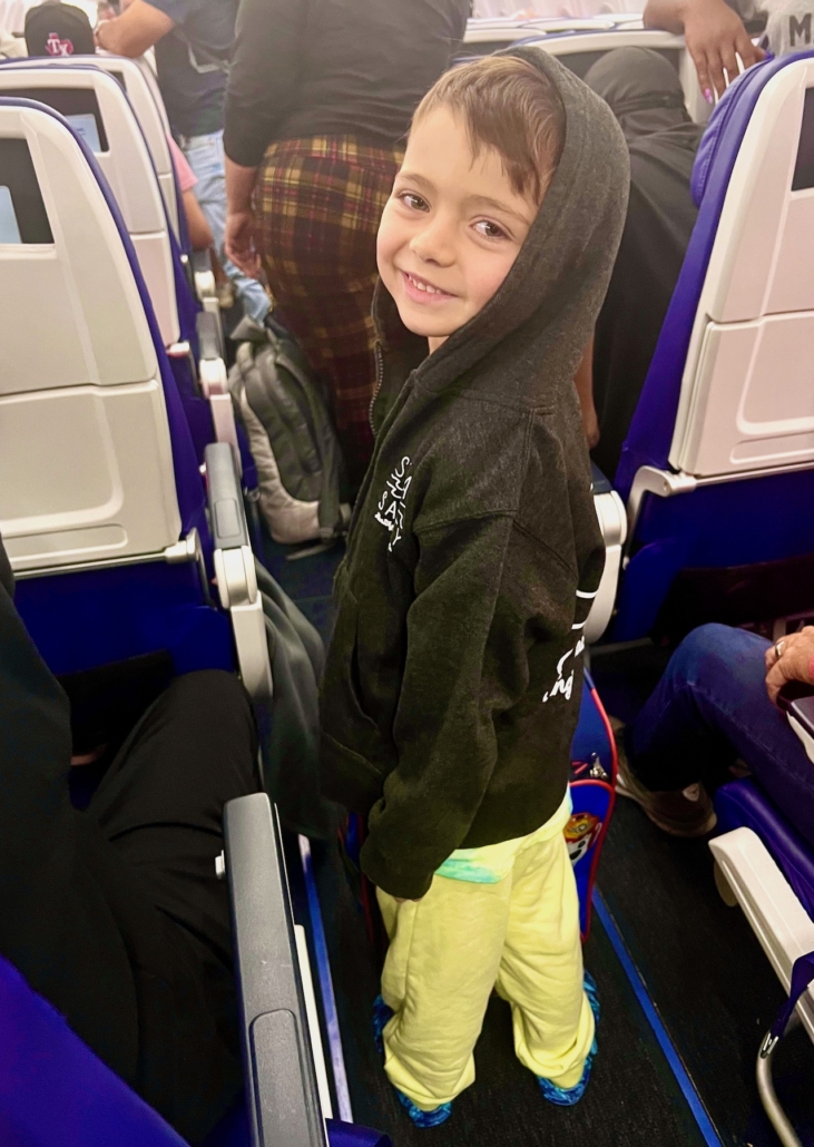 worlschooling kid on the airplane