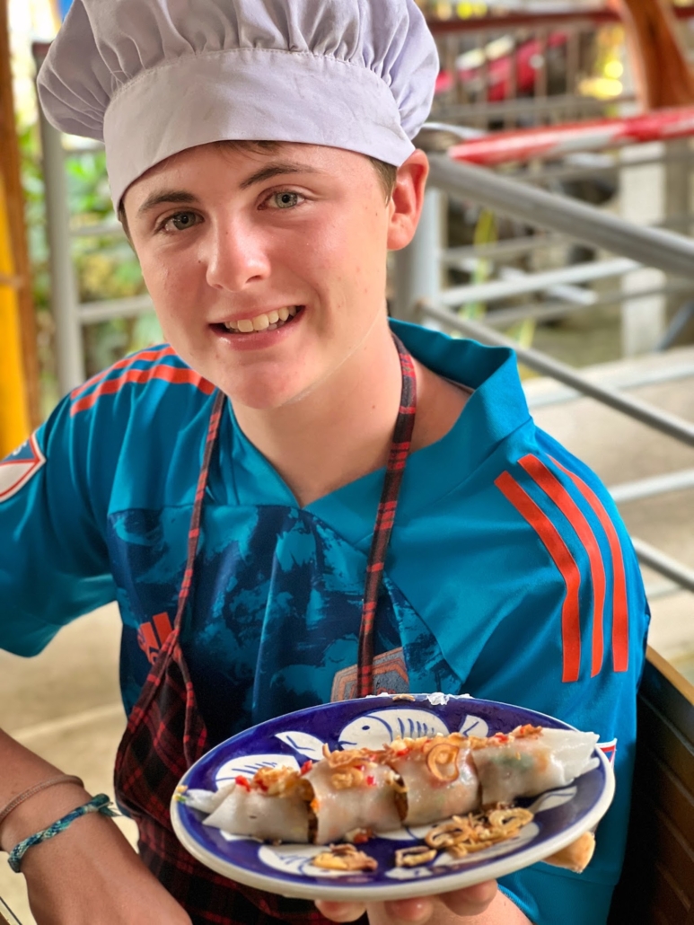 boy learning to cook while worldschooling, 4AlmondsAbroad